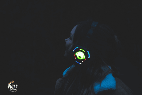 Girl with headphones at night
